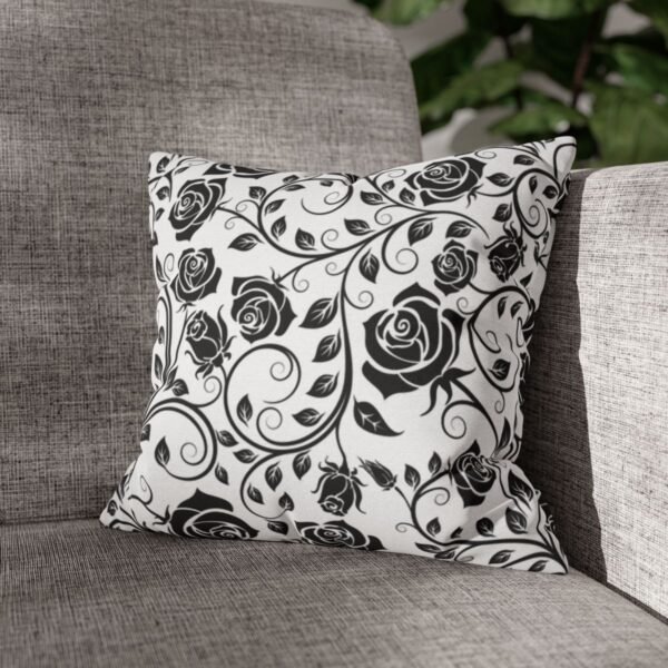 Black vintage roses throw pillow on sofa