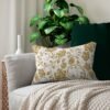 Gold Roses Lumbar Pillow on couch