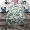 Green Vintage Roses floral table runner on table