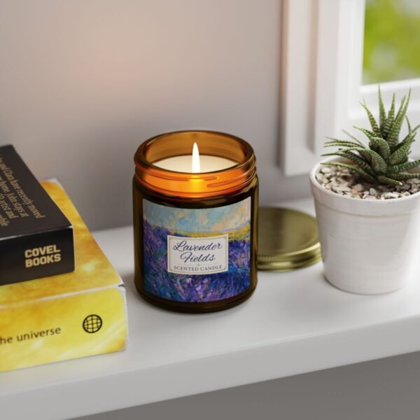 Lavender Fields lit candle in amber jar with gold lid sitting on shelf Lavender Fields lit candle in amber jar with gold lid sitting on shelf