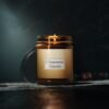 cinnamon vanilla lit candle 9oz amber jar with gray studio lights