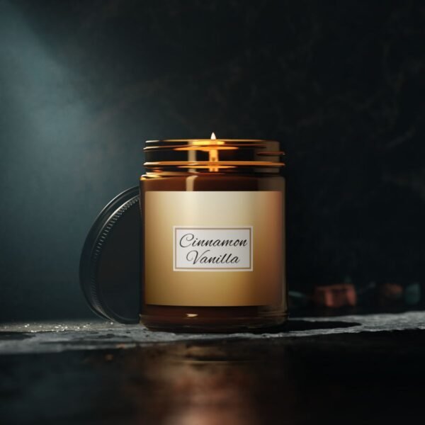 cinnamon vanilla lit candle 9oz amber jar with gray studio lights