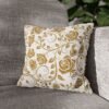 gold vintage roses throw pillow on sofa