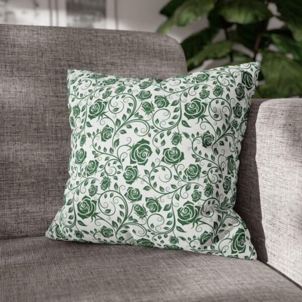 green roses pillow on couch