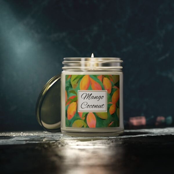 mango coconut lit candle clear jar with gray studio lighting