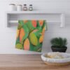 mangoes kitchen tea towel hanging on rack