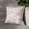 pink vintage roses throw pillow on sofa