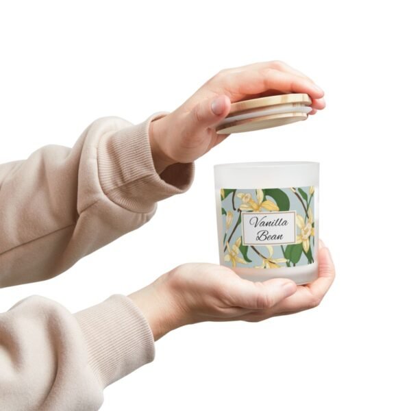 vanilla bean wood wick candle with hands holding jar and lid vanilla bean wood wick candle with hands holding jar and lid