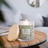 Lemon Verbena wood wick lit candle sitting on table Lemon Verbena wood wick lit candle sitting on table