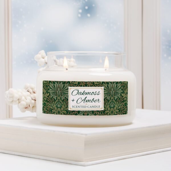 Oakmoss Amber candle in a double wick apothecary jar in winter scene Oakmoss Amber candle in a double wick apothecary jar in winter scene