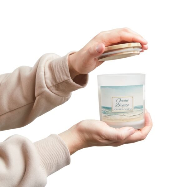 Ocean Breeze wood wick candle with hands holding jar and lid
