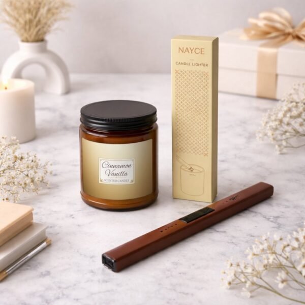 Cinnamon Vanilla candle with electric lighter sitting on counter