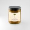 Coconut Cardamom Cream candle in amber jar with black lid