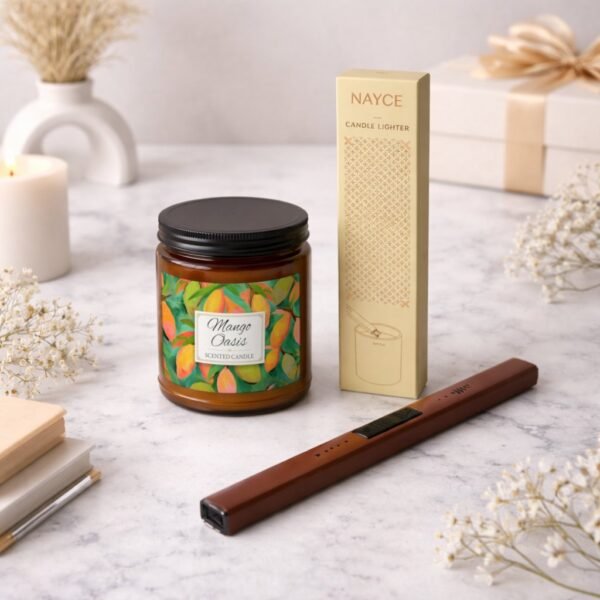 Mango Oasis candle and electric lighter sitting on a counter