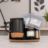 Sea Breeze Candle and Tea gift set with match jar and black mug sitting on counter