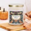 Strawberry Thief 9oz apothecary candle on counter with pumpkin