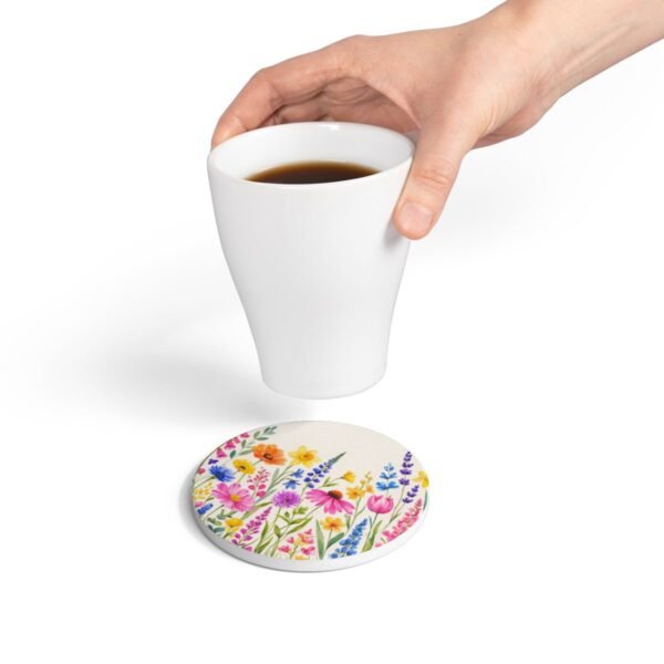 spring flowers ceramic tile round coaster with hand holding coffee cup spring flowers ceramic tile round coaster with hand holding coffee cup