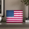 american flag metal art on shelf