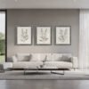 Tranquil Botanical Trio wall art in driftwood gray frames in living room Tranquil Botanical Trio wall art in driftwood gray frames in living room