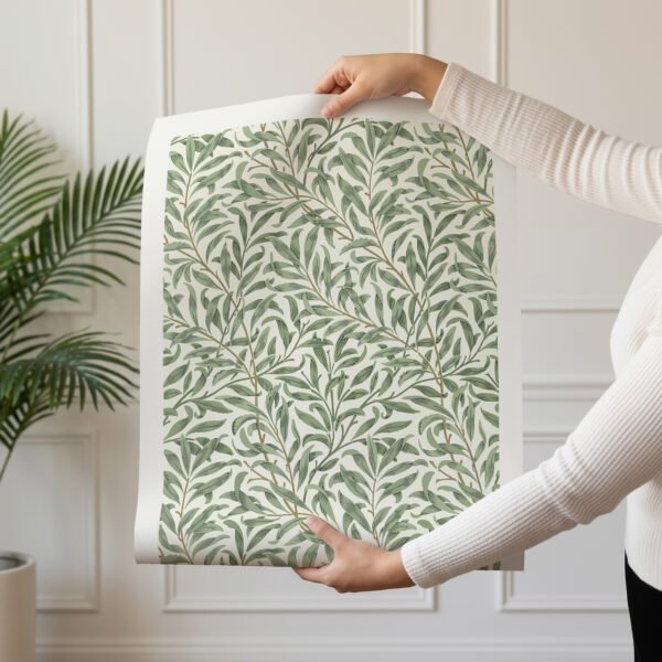 Willow Bough poster unframed with woman holding rolled print